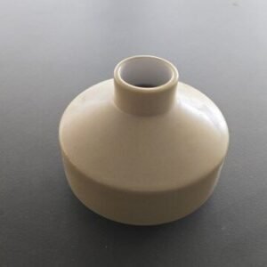 Kupo - a small, minimalist beige ceramic vase with a wide, rounded body and a narrow opening at the top.