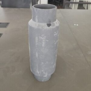 Gray vase features a cylindrical, ribbed texture and a concrete-effect finish.