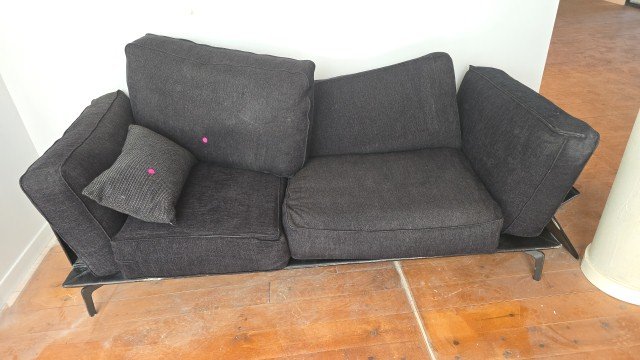 Charcoal - modern dark-grey upholstered sofa features a black metal frame and legs, and includes separate back cushions and a matching throw pillow.
